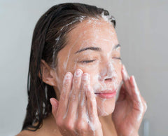 Back and shoulder area being cleansed for body acne.