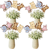 32 SPIRITS Winnie centerpieces brighten baby shower tables.