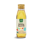 365 by Whole Foods Market Organic Sesame Seed Oil pouring over a hot stir-fry