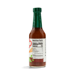 Pouring 365 stir-fry sauce for a quick, flavorful veggie and protein stir-fry