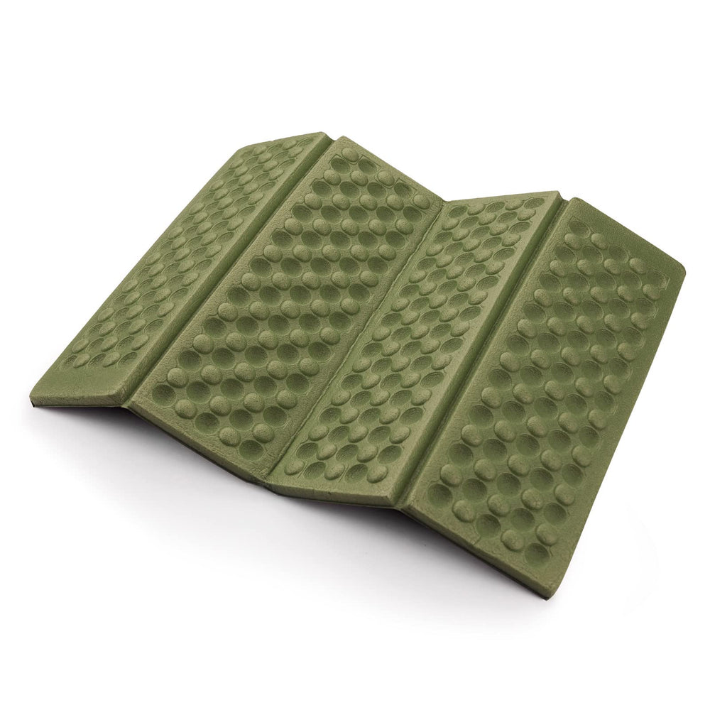 AceCamp Sitting Pad open on rocky ground provides comfortable seating on uneven trails.