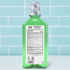 Close-up of ACT Total Care Zero Alcohol Mouthwash Fresh Mint label with fluoride and no alcohol.