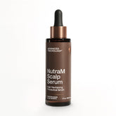 Advanced Trichology NutraM bottle being poured for controlled scalp application.
