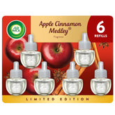 Air Wick plug-in refill Apple Cinnamon Medley pack enhances cozy autumn ambiance in living rooms.