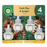 Air Wick plug-in refill bottle with Fresh Pine & Juniper scent for a refreshed living room.