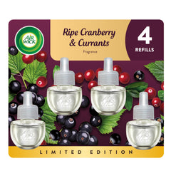 Air Wick plug-in refill bottle emits ripe cranberry currants aroma for fresh living spaces.
