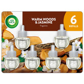 Air Wick plug-in scented oil refill Warm Woods Jasmine bottle ready for continuous fragrance.