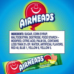 Closeup of tangy Airheads Sour Watermelon Punch bars in hand