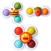 ALASOU 3Pcs Pop Spinner set on the fridge shows strong suction for quiet, hands-on fun.