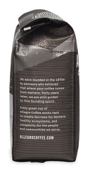 Close-up of Half Caff grounds releasing smoky aroma and subtle fruit notes.