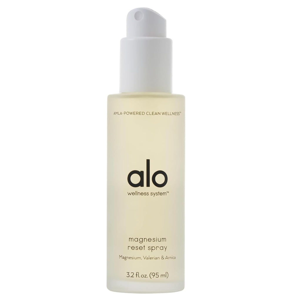 Alo magnesium oil spray bottle close-up for quick nighttime relaxation.