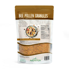 Alovitox Bee Pollen granules on a spoon ready to sprinkle