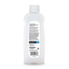 Amazon Basics Baby Oil texture closeup shows a light, easily spreadable formula.