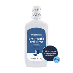 Pouring Amazon Basics Dry Mouth Oral Rinse signals easy daily use