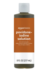 Amazon Basics First Aid Antiseptic bottle shows wound cleaning on the go.