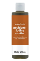 Amazon Basics First Aid Antiseptic bottle shows wound cleaning on the go.