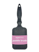 Amazon Basics Paddle Brush for Hair showing gentle detangling on wet or dry hair