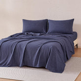 Amazon Basics blue flat sheet shows silky softness and easy care.