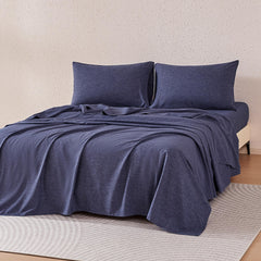 Amazon Basics blue flat sheet shows silky softness and easy care.