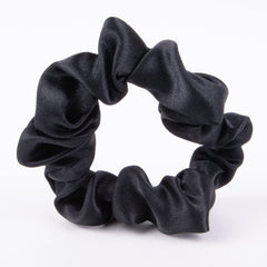 Amazon Basics satin scrunchies worn on the wrist add a soft, chic accessory.