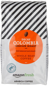 Amazon Fresh Decaf Colombia whole bean 3-pack on counter for convenient mornings.