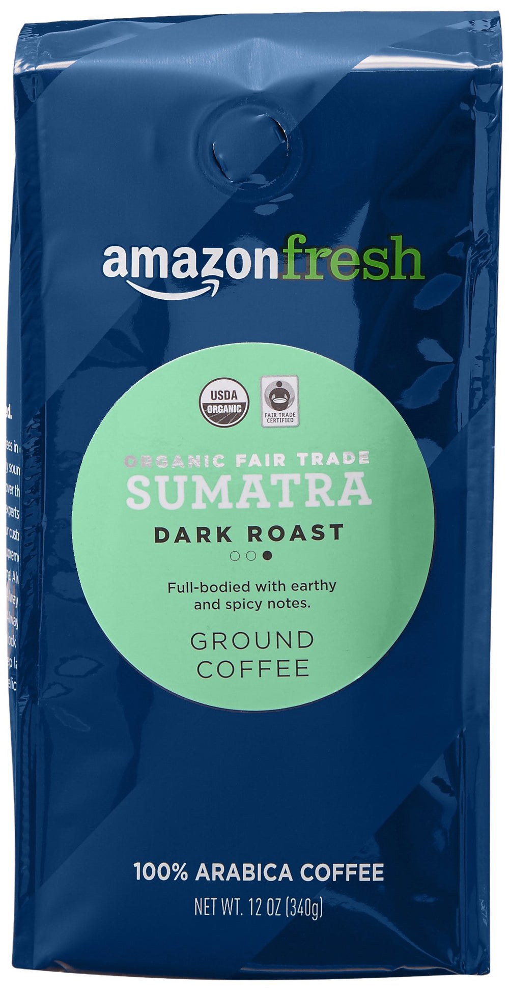 Amazon Fresh Sumatra ground coffee label highlights organic and fair-trade status.