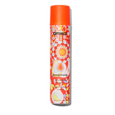 Amika Headstrong hairspray bottle showing strong hold with a light mist.