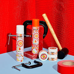 Closeup of Amika Headstrong hairspray showing fine mist for even application.