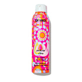 Amika Perk Up Ultra Dry Shampoo bottle pouring to control oil and refresh roots.