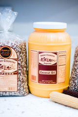 Amish Country Popcorn coconut oil 1 gallon pouring into popcorn popper.