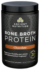 Ancient Nutrition bone broth protein powder chocolate being poured into mug for warmth