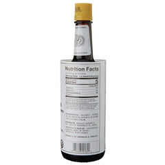 Close-up of Angostura label and yellow cap, premium cocktail flavoring.