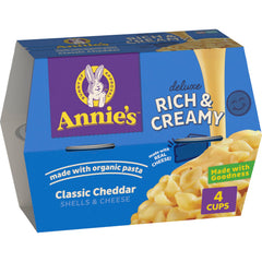 Annie's Classic Cheddar Deluxe mac and cheese cups packaging highlights organic pasta for quick family meals.