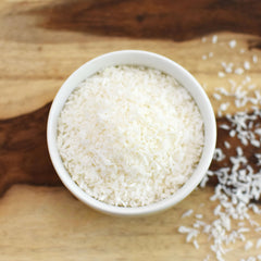 Anthony's Organic Shredded Coconut topping on ice cream for dairy-free sweetness.