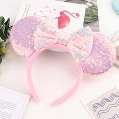 Close-up of glittery sequins on AQOKKA headband for glam looks.