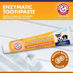 Arm & Hammer enzymatic dog toothpaste for puppies shown with toothbrush to promote gentle cleaning.
