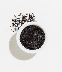 Art of Tea steeped tea being poured into a cup.