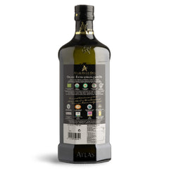 Atlas Olive Oils glass bottle close-up showing clarity of unprocessed EVOO.