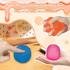 AuraGlaze Squishy Fidget pink ball in hand for anxiety relief and focus.