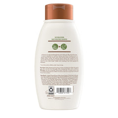 Creamy Aveeno lather demonstrates gentle cleansing for dry hair.
