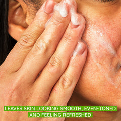 Aveeno Positively Radiant scrub beads close-up highlights gentle exfoliation for smoother skin