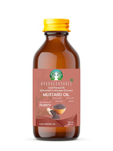 AYURVEDASHREE mustard oil extracted on a wooden churner for rich nutrition.