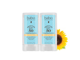 Babo Botanicals Sensitive Baby Mineral Sunscreen Stick SPF 50 gliding onto delicate skin for protection.