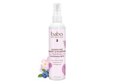 Babo Botanicals smoothing berry conditioning spray bottle for gentle detangling and frizz control.