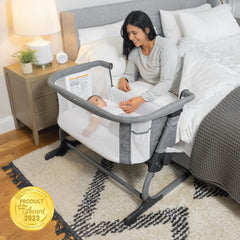 Dreamer Bassinet bedside panel unzip for bedside access.