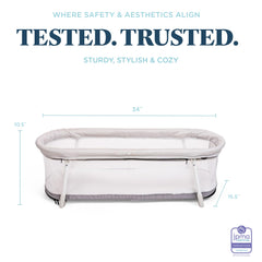 Lightweight Baby Delight Snuggle Nest Bassinet moves between rooms easily.