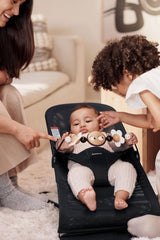 BabyBjorn Googly Eyes bright shapes captivate infant attention and curiosity.
