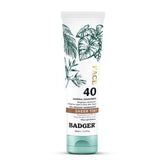 Badger tinted sunscreen bottle closeup showing SPF 40 and compact travel-friendly packaging