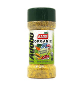 Badia Organic Adobo Seasoning bottle on kitchen counter adds versatile flavor to meats and veggies.