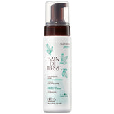 Bain de Terre Rise N' Shine bottle pouring for instant root lift.